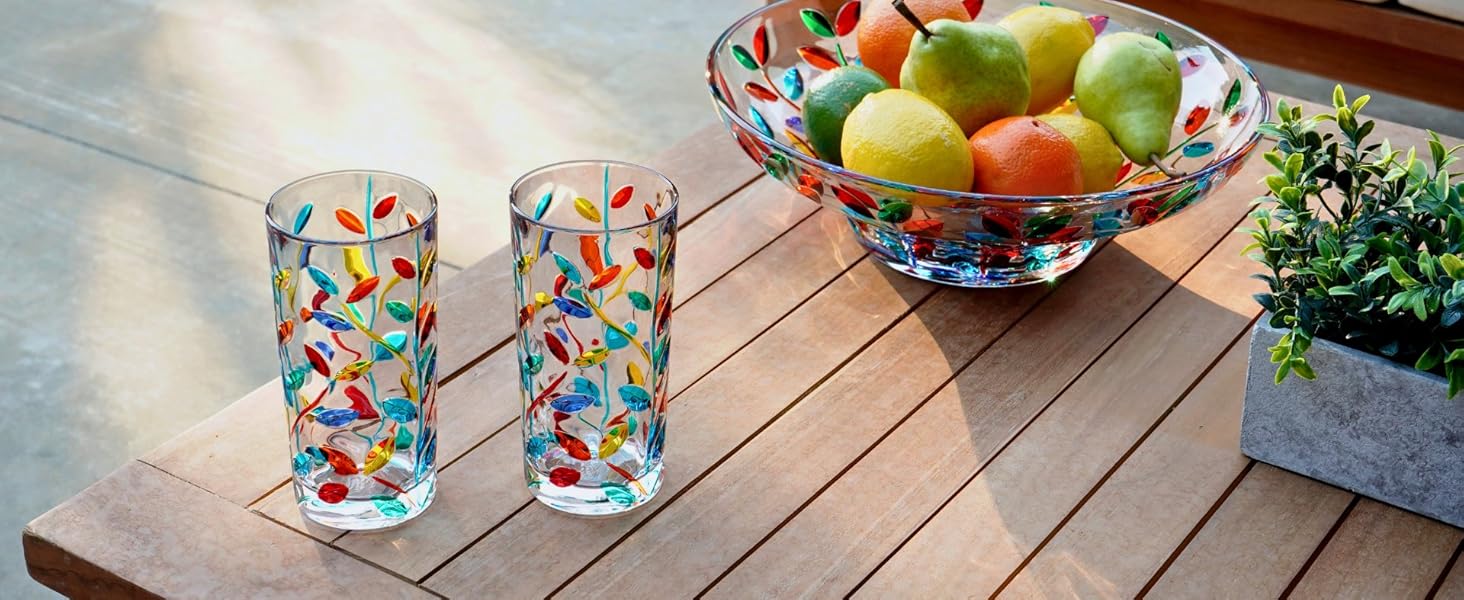 italian crystal tall drinking glasses and crystal centerpiece bowl on wood table for patio decor
