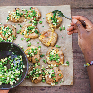 top down photograph of Terry’s hands preparing a recipe with vibrant green peas