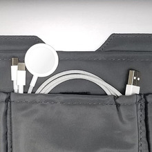This image shows a travel organizer with a 3 in 2 cable inside of one of its pockets