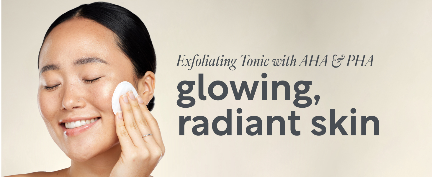 Woman smiling with unclogged pores and clear complexion exfoliating toner. 