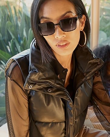 woman in seat wearing dark sunglasses