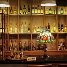a bar with a lamp and bottles of liquor