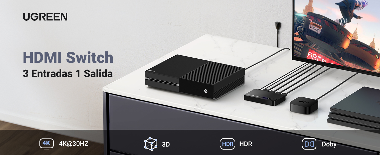 una xbox one negra con una xbox one negra y un altavoz bluetooth sobre una mesa de mármol blanco.