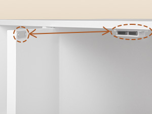 Diagramm, das einen orangefarbenen Pfeil zeigt, der einen kreisförmigen Bereich links mit zwei rechteckigen Formen auf der rechten Seite verbindet, vor einem weißen Hintergrund mit sichtbaren Eckkanten.