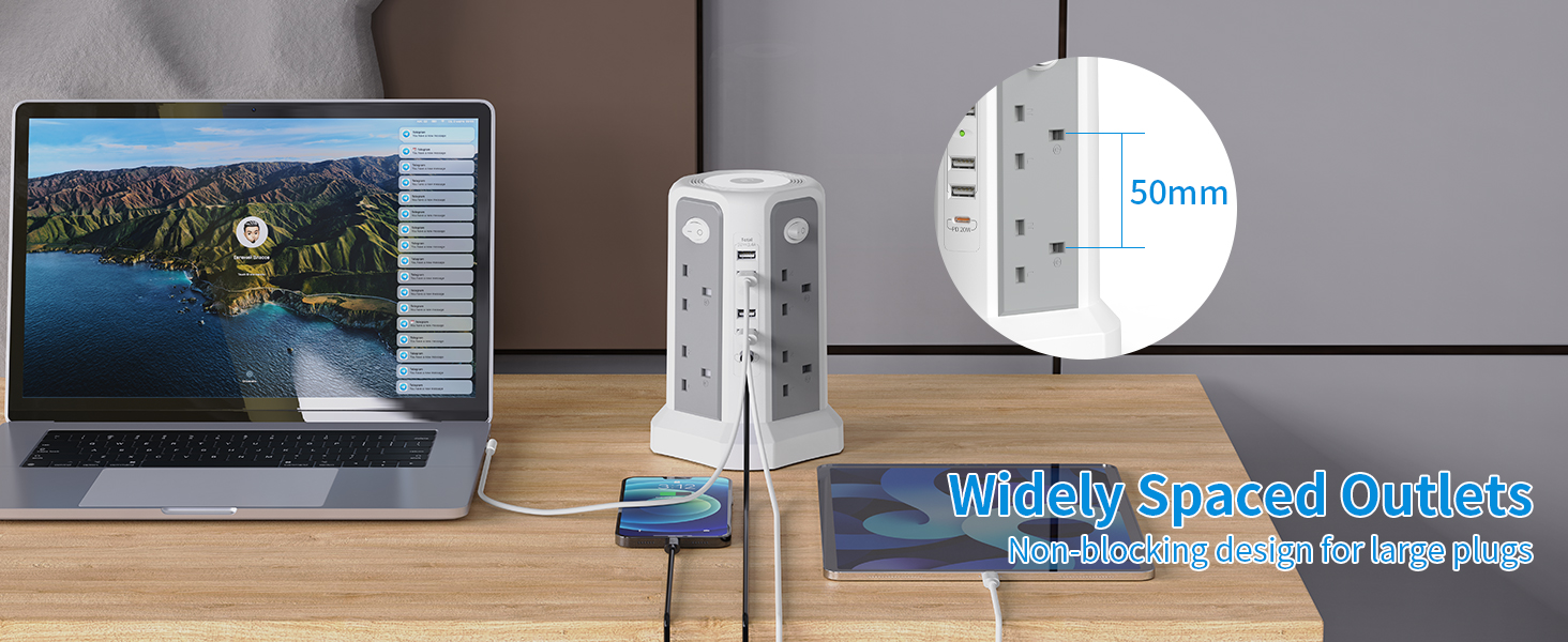 Collection of white smart home devices or speakers arranged on wooden surface against gray background.