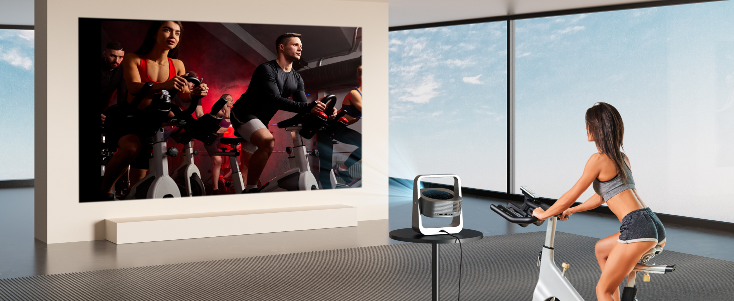 avec un grand écran de projection affichant du contenu sur le cyclisme, avec vélo d'appartement positionné pour une expérience d'entraînement immersive.