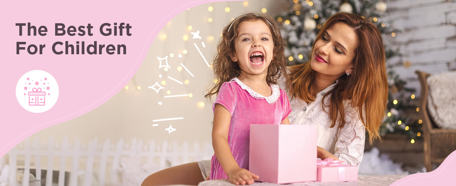 A woman and young girl sit together, smiling and holding a pink gift box. Text overlay reads 'The Best Gift For Children'. Background includes Christmas lights.