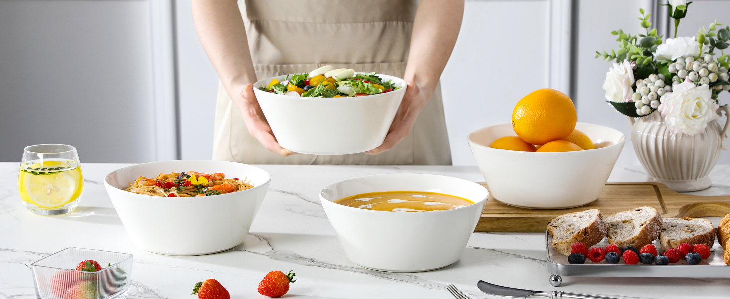a person holding a bowl of salad