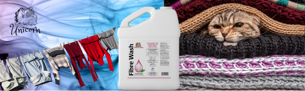 unicorn fibre wash gallon everyday clothing drying cat resting on wool sweaters
