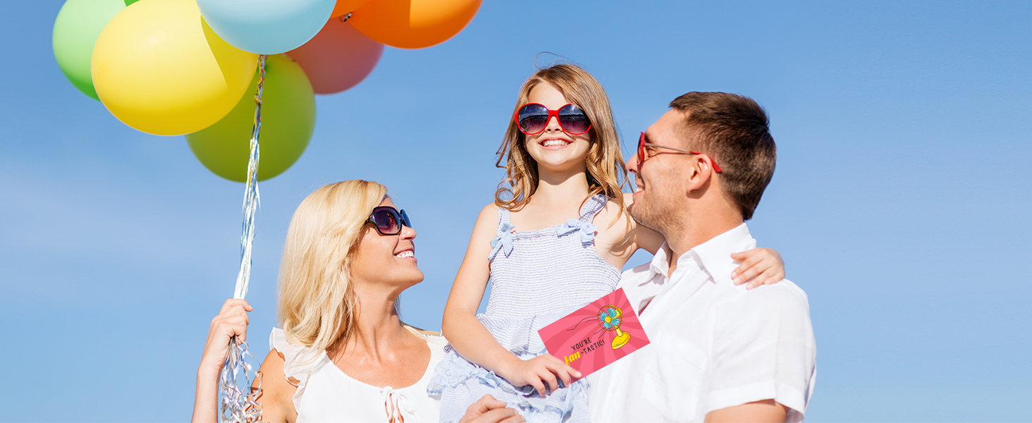 A photo of a family celebrating their kids' birthday with the thank you cards for kids