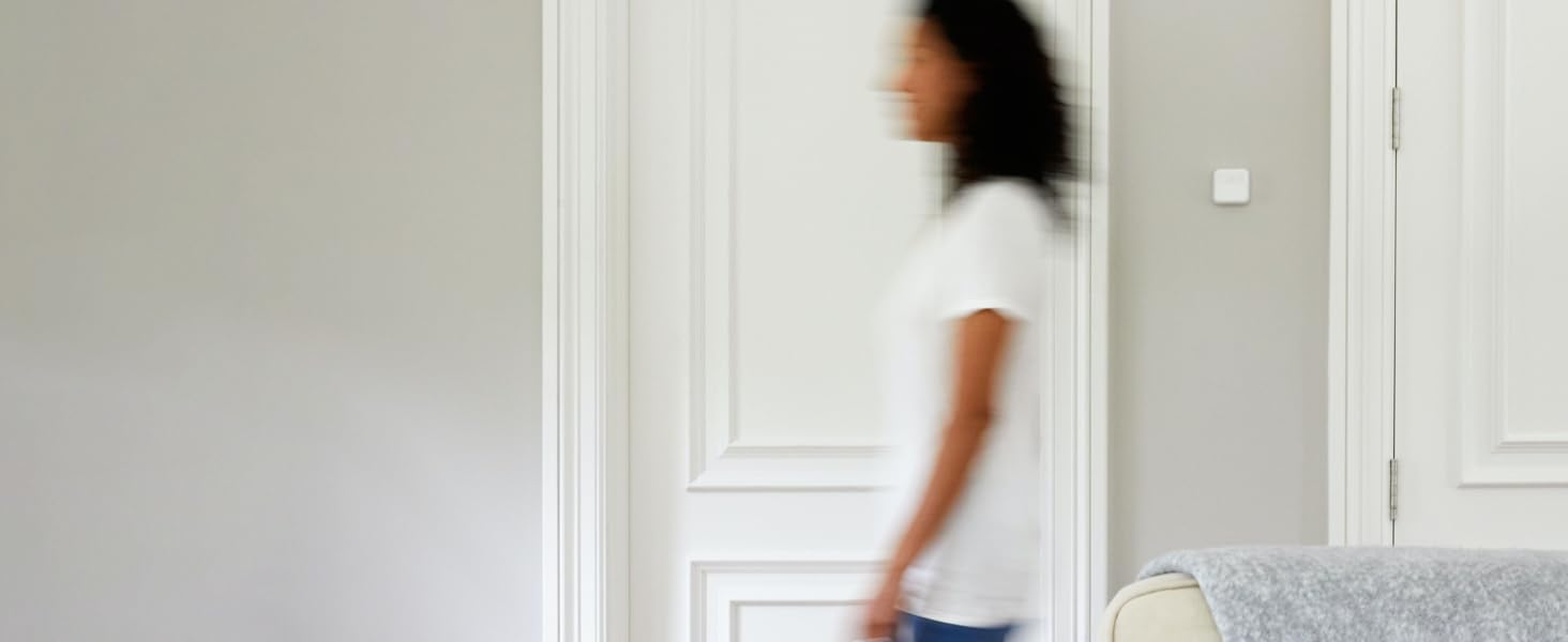 Woman walking past a Smart Room Sensor