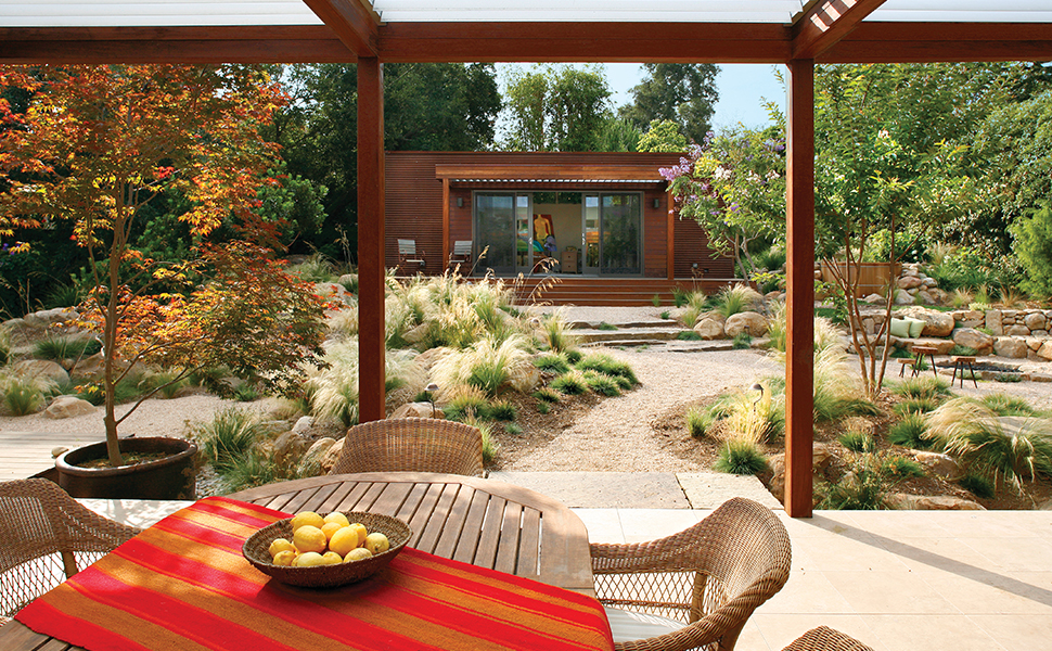 a table setting in a desert garden from beyond the garden