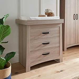 The Isla Dresser / Changing table in Ash offers ample storage with 3 ample drawers
