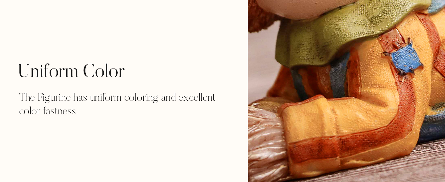 Close-up of a plush toy's foot, showing orange and brown fabric with stitching. A green fabric, possibly part of clothing, is visible above.