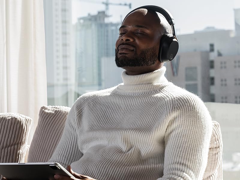 A man relaxing listening epic lux lab edition headphones