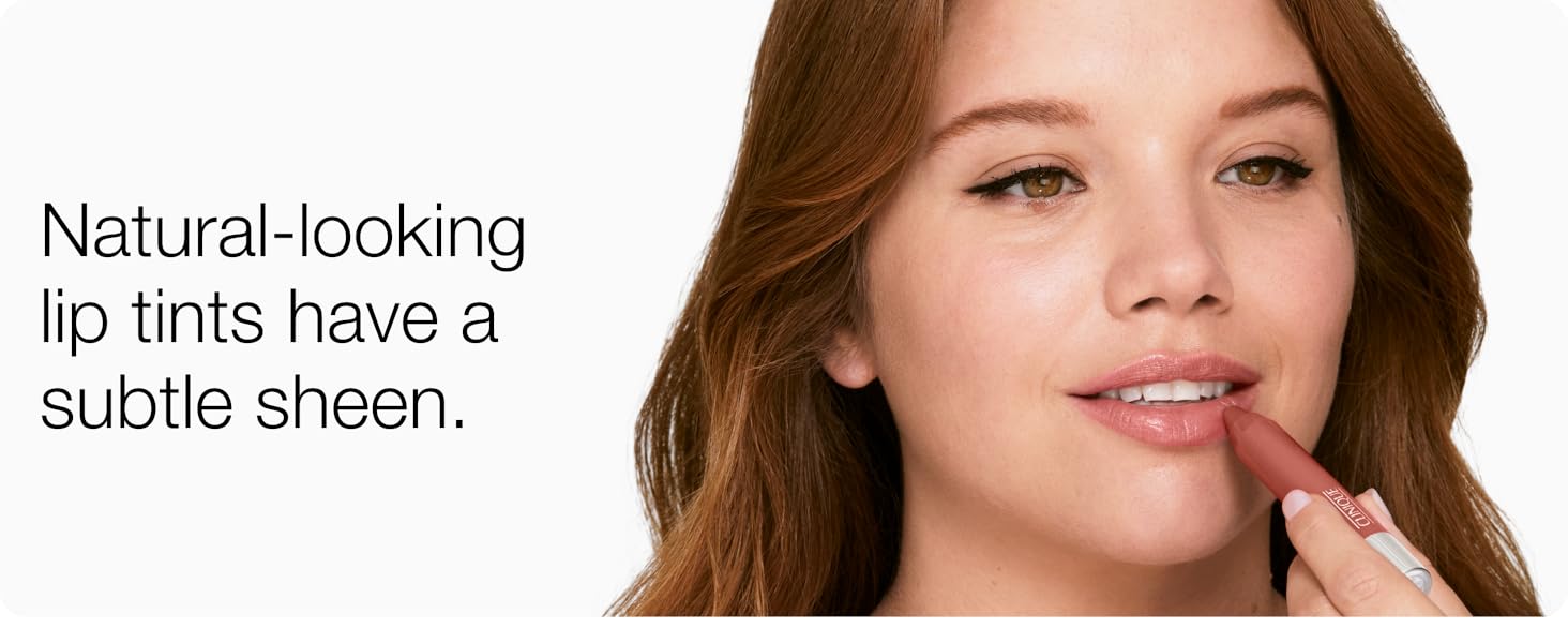 Text reads 'Natural-looking lip tints have a subtle sheen.' Product demonstration showing lip cosmetic application.