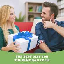 a woman giving the daddy to be a gift