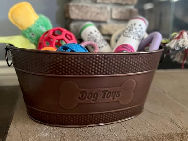 Metal dog basket for toys with embossed dog toys bone on front and back.