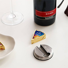Vintorio Wine Foil Cutter, cheese, and a bottle of wine
