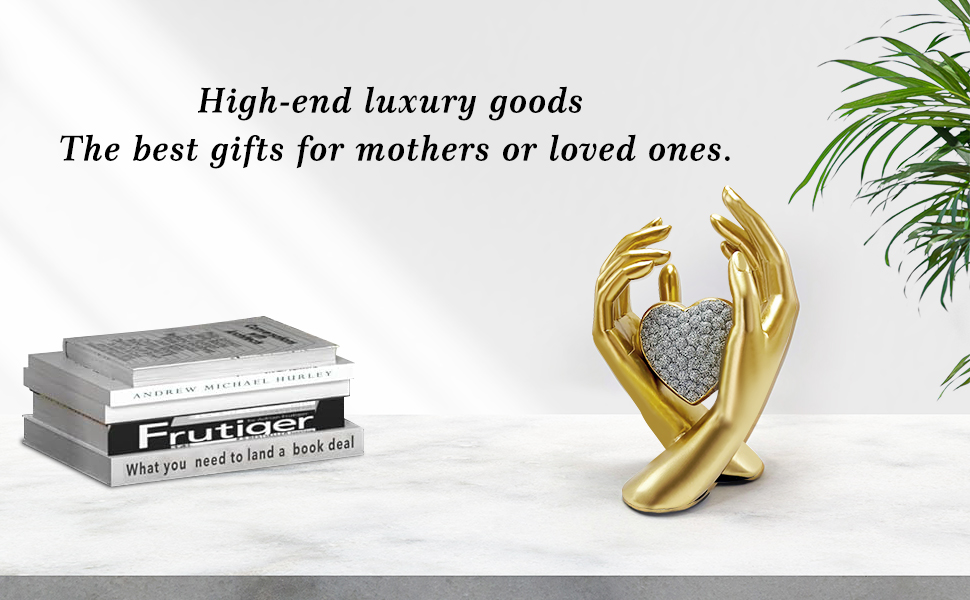 gold heart hands sculpture