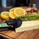 Knife on cutting board with knife grip