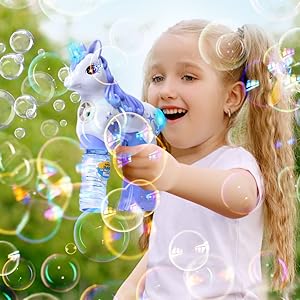 girl playing with bubblen gun
