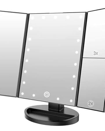Tri-fold vanity mirror with LED lighting around edges, mounted on black base. Shows three-panel design for multiple viewing angles.