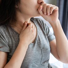 Nature's Jeannie. Woman congested blowing nose.