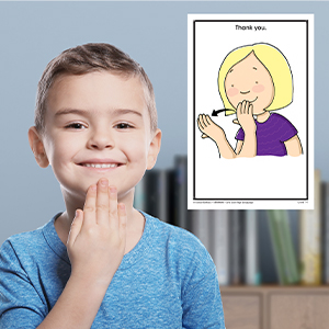 A child practicing a sign with the cards