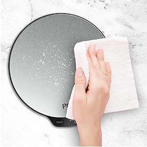 a hand wiping a dish towel