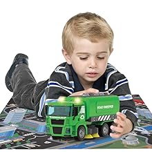A boy plays with DIY garbage truck