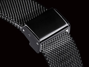 Close-up of a silver mesh watch band with a sleek black rectangular watch face, showcasing the band's fine metal weave and secure clasp attachment.