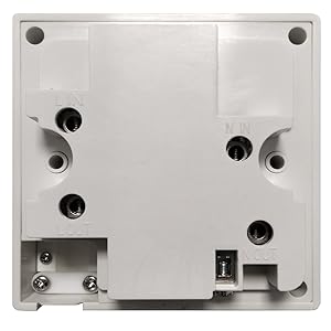 White rectangular device with multiple ports and openings, possibly an electronic control unit or junction box. Features screw holes and various connectors.
