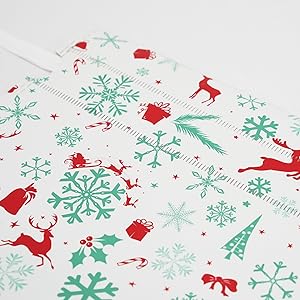 christmas wrapping paper with a reindeer and snowflakes