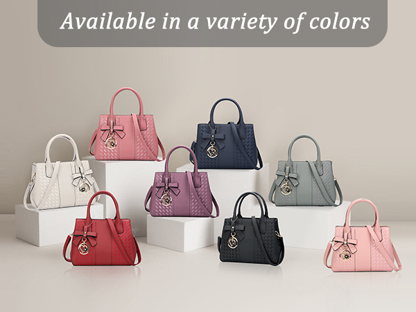 Display of handbags in various colors including pink, navy, white, and gray, with flower embellishments and structured designs.