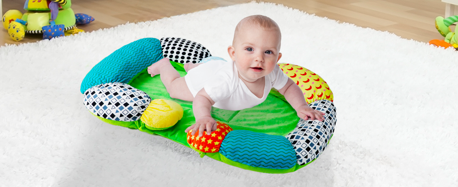 Baby enjoys tummy time on the play mat
