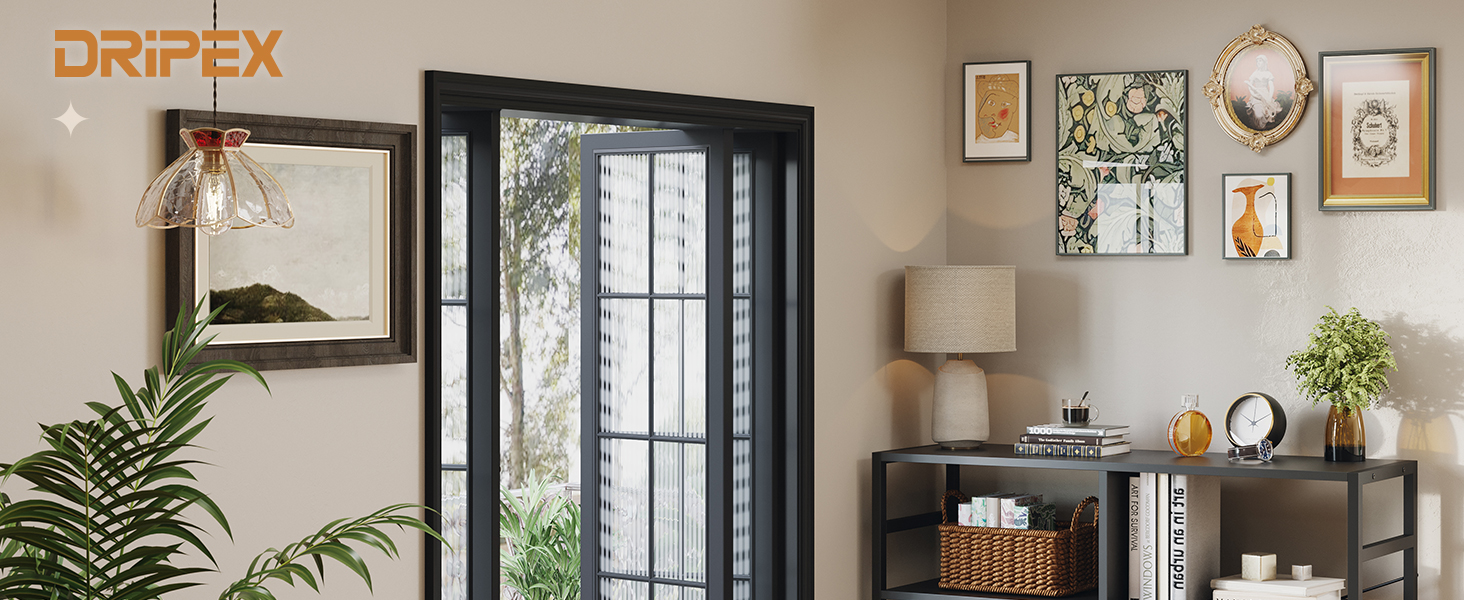 Modern interior space with black-framed glass door, decorative wall art gallery, potted plant, and lamp against neutral walls.