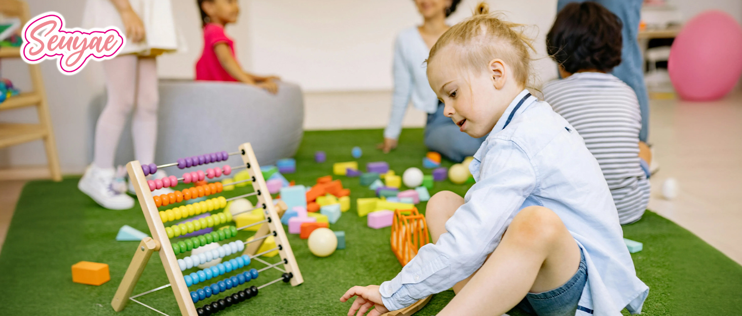 A group of children are playing together with colorful toys on a green carpet