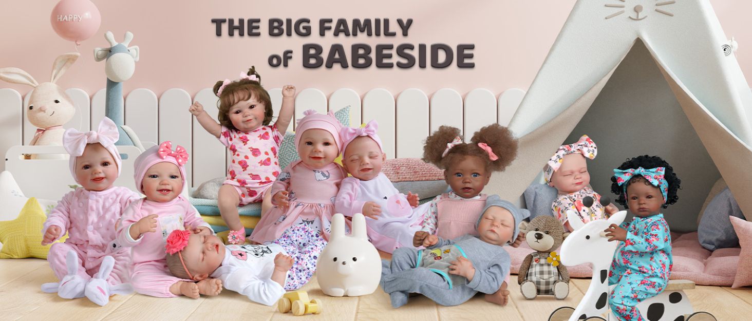 Collection of baby dolls arranged on a pink surface with a teepee tent in background. Various dolls wear different outfits and accessories.