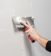 Tuff Grip Drywall Taping Knife smooth drywall mud over a new wall