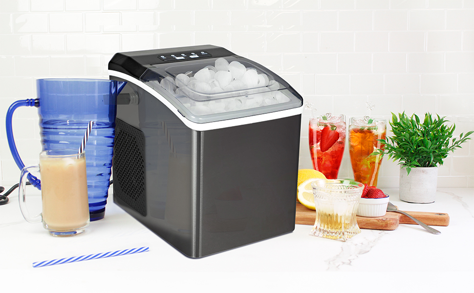 Ice maker surrounded by a blue pitcher and glasses of juice, iced tea, water, and iced coffee