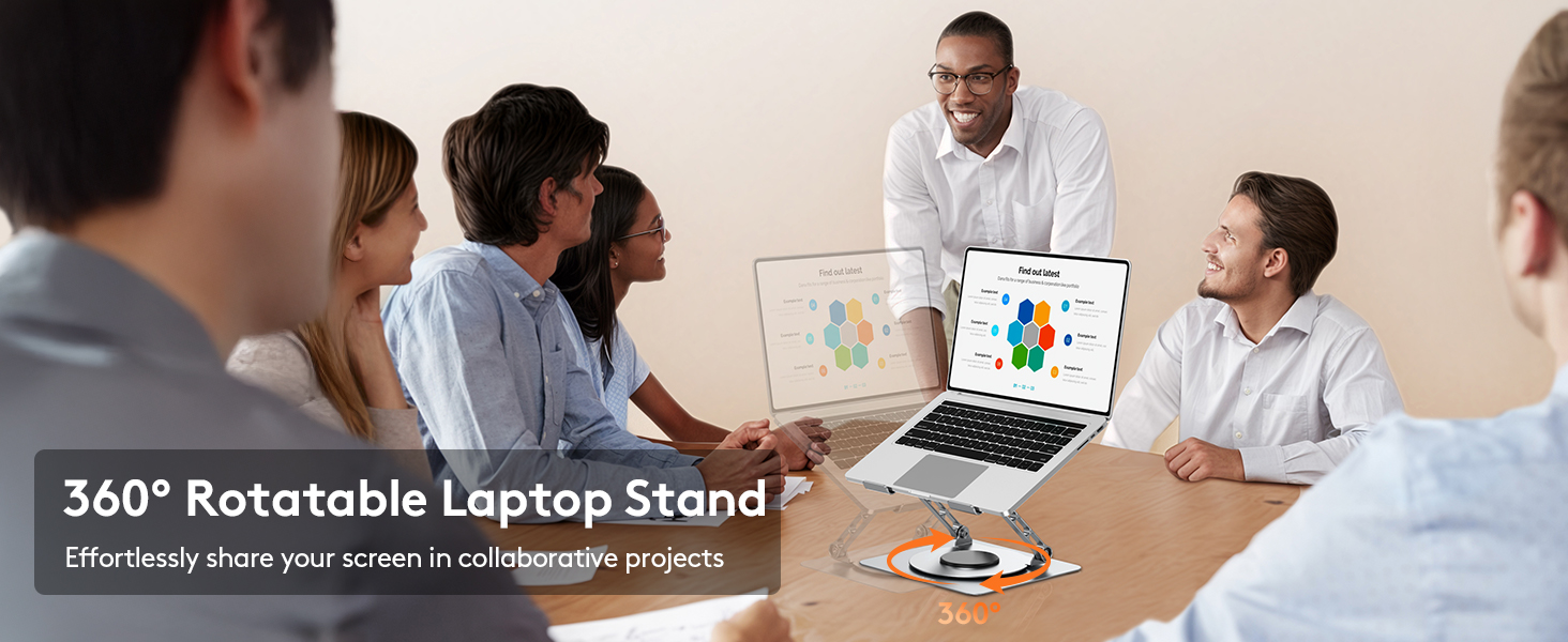 Professional office meeting scene showing people collaborating around a conference table with laptops and documents.