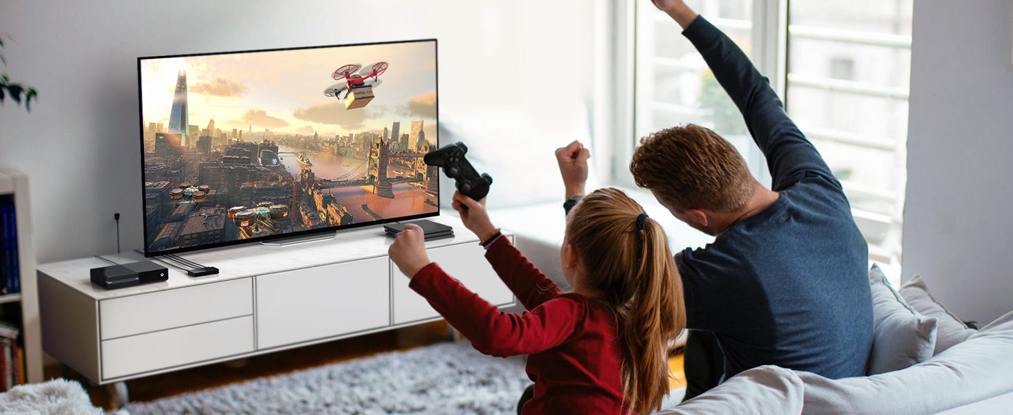 una familia jugando videojuegos en la televisión