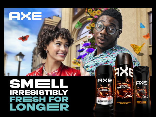 AXE body sprays upfront with a man & woman in city with colorful butterflies & flowers behind them.