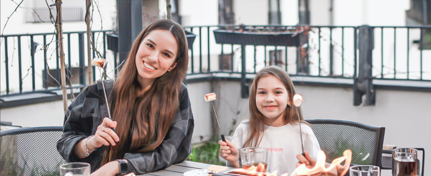 Outdoor dining scene showing table settings and drinks on a balcony or patio space.