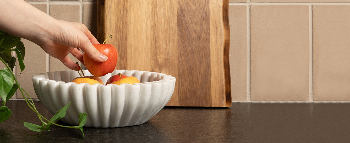 apples being displayed in modern fruit bowl made from Indian marble