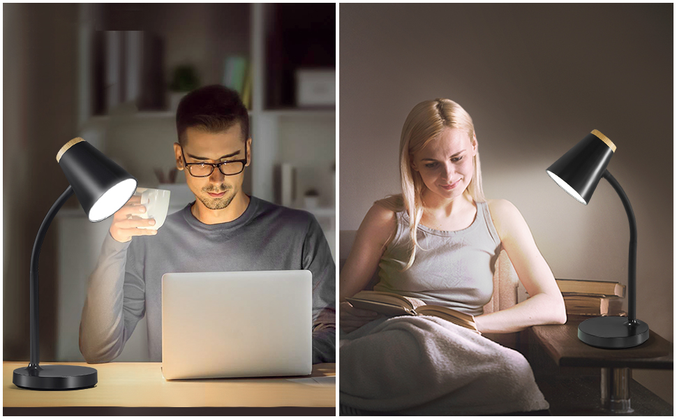 a man and a woman sitting at a desk with a laptop and a cup of coffee.