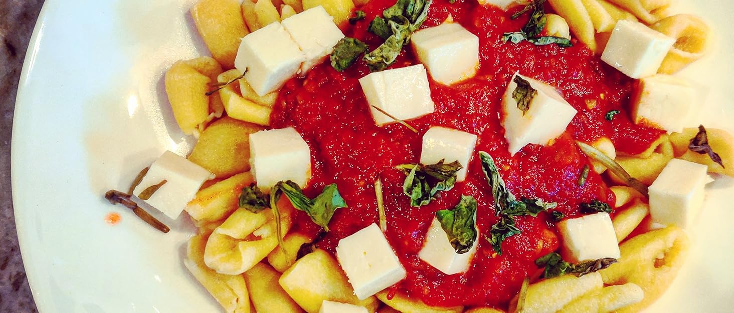 Cavatelli topped with a tomato sauce with fresh basil and mozzarella