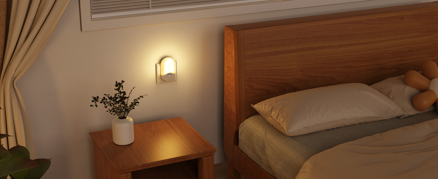 Cozy bedroom scene with wooden bed frame, nightstand, wall-mounted lamp, and white vase with plant. Warm lighting creates a relaxing atmosphere.