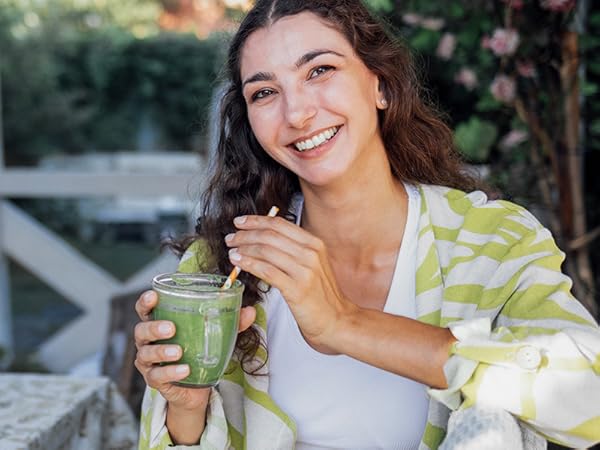 BulkSupplements NAC Capsules woman sipping green smoothie
